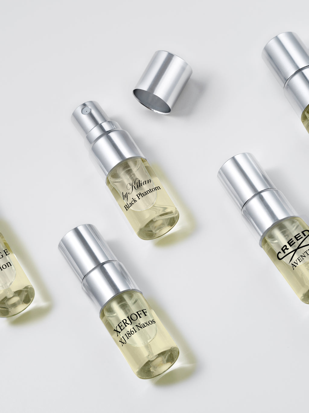 Legends for Him fragrance testers — close-up of 2 ml spray sample vials on white background